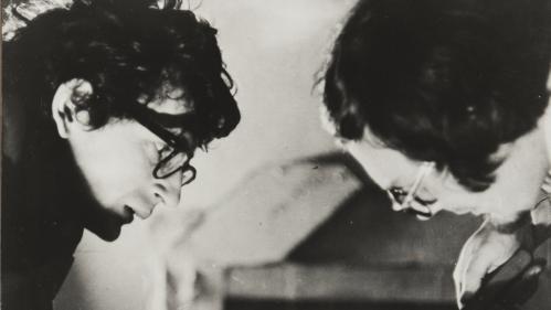 Photograph of Vitaly Komar and Alexander Melamid with a meat grinder in black and white