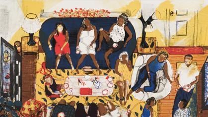room full of people gathered around a table 