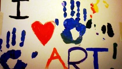 painted handprints and words