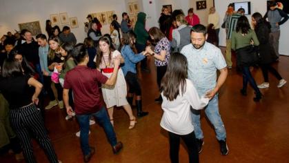 crowd of people dancing in gallery