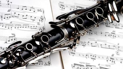 close up of clarinet and sheet music