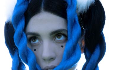 close up of white woman with blue braids