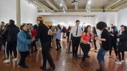 people dancing in a gallery