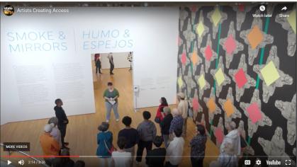 groups of people on a tour in a museum gallery