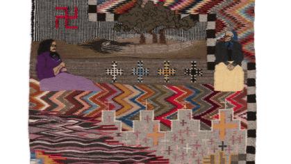 Patterned cloth with abstract imagery and text reading "Ada Nitsijikees".