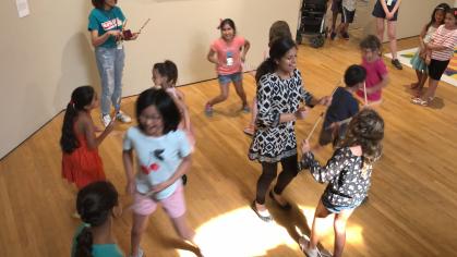 Children dancing with sticks