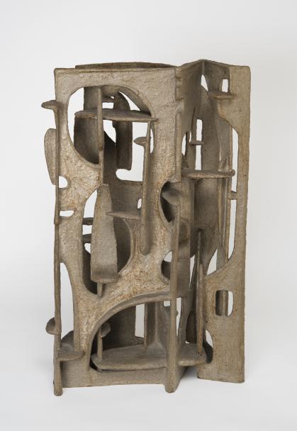 Abstract sculpture with rectangular shapes with cut outs intersecting the open spaces at various angles.