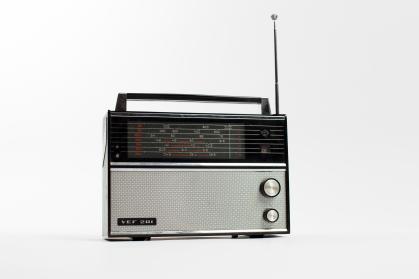 Portable radio made of black plastic and silver metal