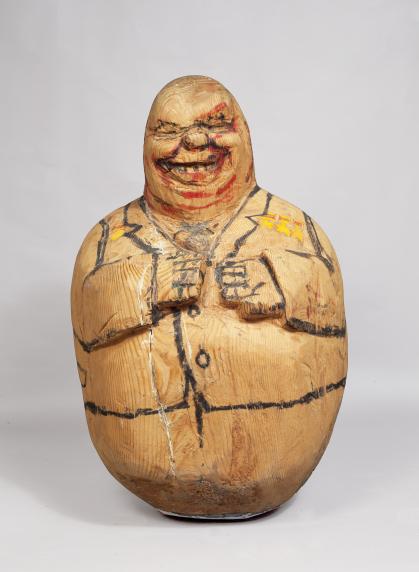 Wooden sculpture of Nikita Krushchev in form of roly-poly doll with rounded base and crudely-drawn features