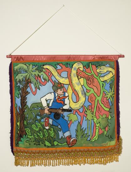 Painting on fringed banner of young boy carrying a gun and running through a jungle; he looks at a large yellow snake in a tree