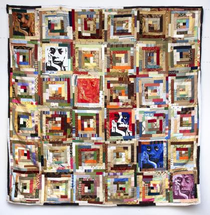 Quilt with repeated images of James Baldwin in varying colors mixed with other more traditional quilt blocks.