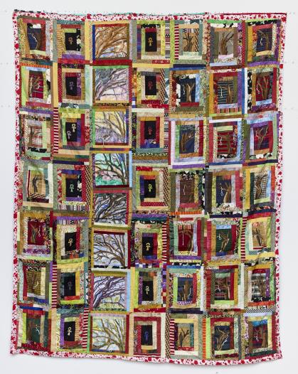 Multicolored quilt with images of trees with nooses attached made of thread and ankh symbols