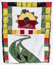 Quilt with image of Harriet Tubman and a green path with white and black footsteps, surrounded by images of other abolitionists.