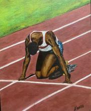 young Black person kneeling at starting line of a race