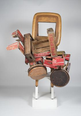 Sculpture made of found wooden objects including Coca Cola and Pepsi crates.