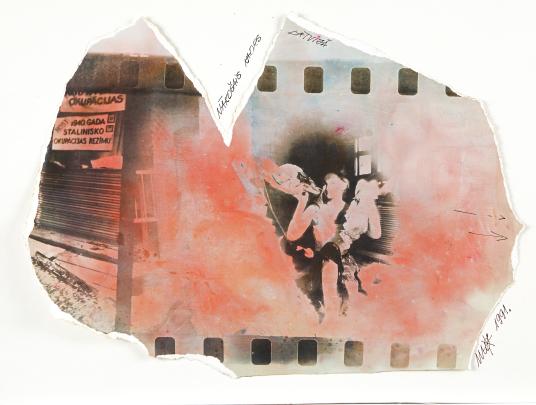 Irregularly shaped photo from negative fragment; a figure can be seen holding a child; pink and blue color applied